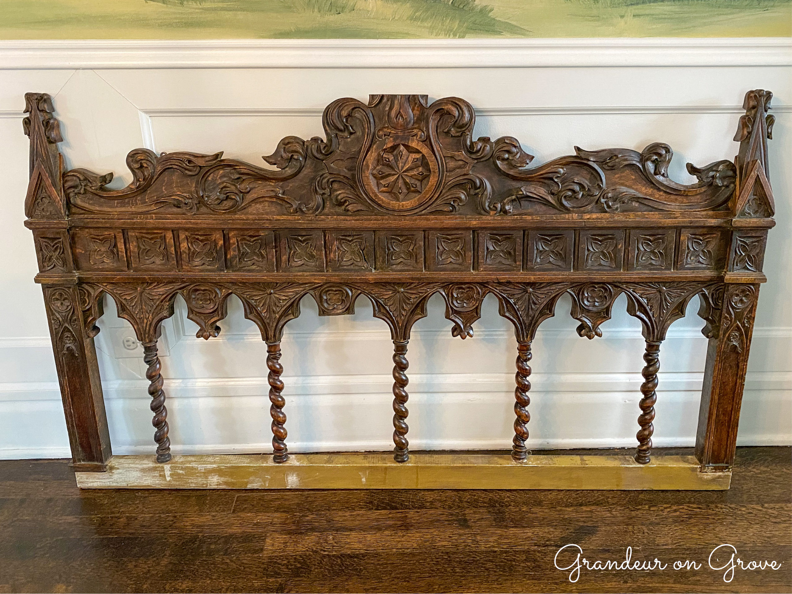 The carved wooden piece after I dusted and polished it. It was previously used as a bed headboard.